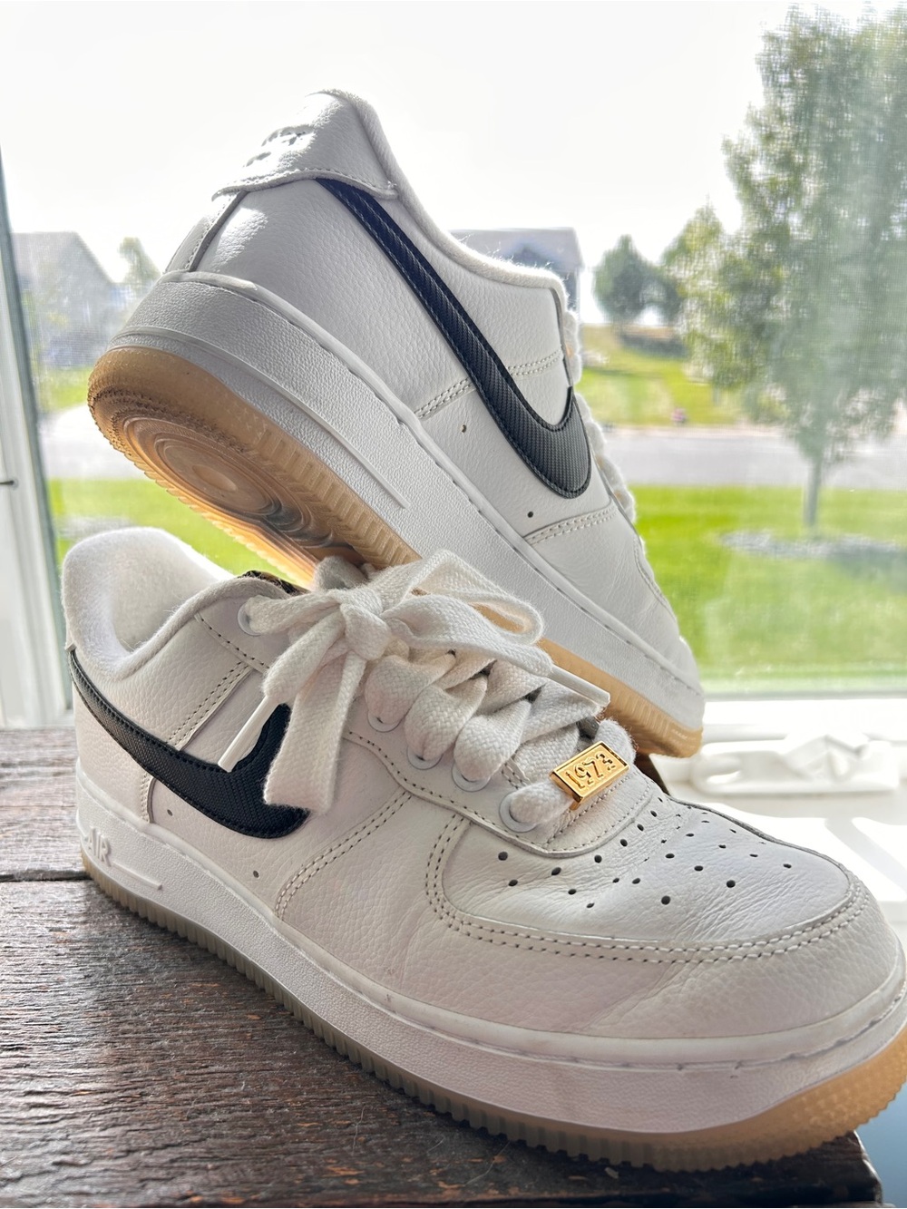Nike Men’s White and black Air Force Ones Anniversary 1973 Edition.